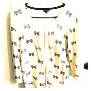 Three quarter sleeve cardigan with black bows.